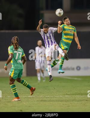 St. Petersburg, FL: Louisville City FC defender Amadou Dia (3) and Tampa Bay Rowdies forward Sebastián Guenzatti (13) go up for a header during a USL Stock Photo