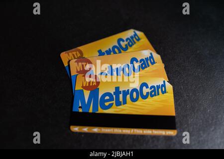 Manhattan, New York/USA - March 26. 2021: Three Metro cards of MTA in New York City, ticket to use subway and bus in NYC. Public transport in America Stock Photo