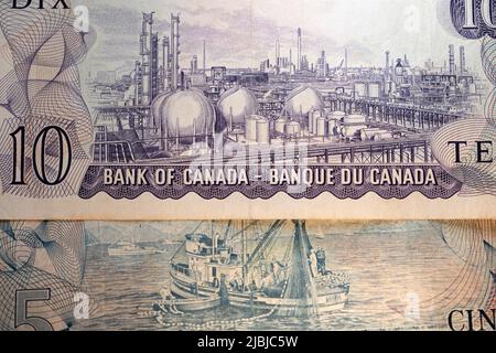 Toronto, Canada - October 30. 2021: Scenes of Canada Banknotes, rear side of canadian paper money. Oil refinery on 10 dollar bill Stock Photo