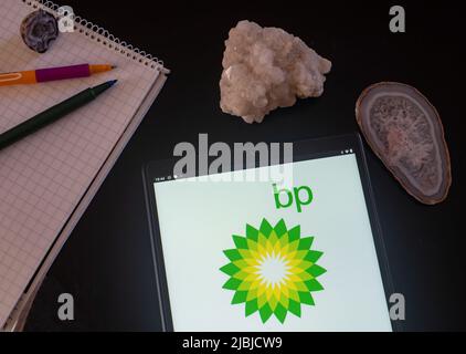 Germany. 28th May, 2022. In this photo illustration, BP plc (official styling BP p.l.c., formerly The British Petroleum Company plc and BP Amoco plc) logo seen displayed on a tablet. Credit: SOPA Images Limited/Alamy Live News Stock Photo