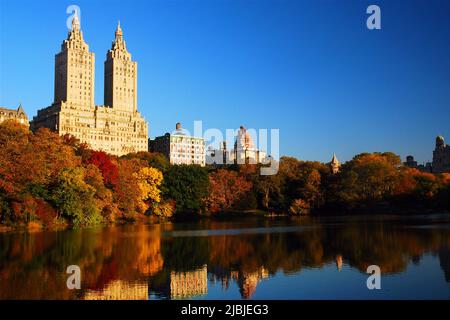 The San Remo Apartments rise over the autumn colors and fall foliage of Central Park in New York City Stock Photo