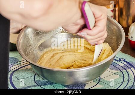 Chef kneading the filling for making pie in bowl Stock Photo