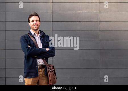 smiling man entrepreneur with arms folded Stock Photo