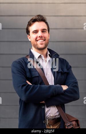 smiling man entrepreneur with arms folded Stock Photo