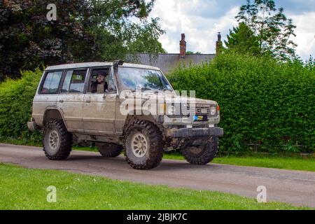 1988 80s, eighties Dirty, muddy, Mitsubishi Shogun Utility vehicle arriving in Worden Park Motor Village, Leyland, UK Stock Photo