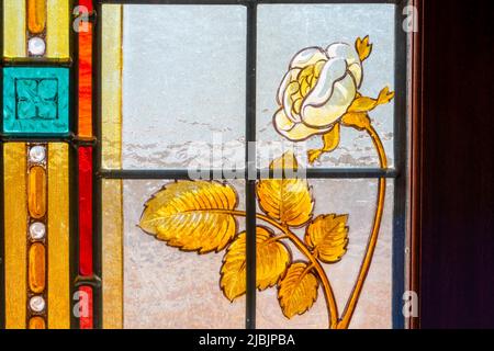 An ornate stained glass window within the auditorium on the Grand Theatre in Blackpool, Lancashire, UK Stock Photo