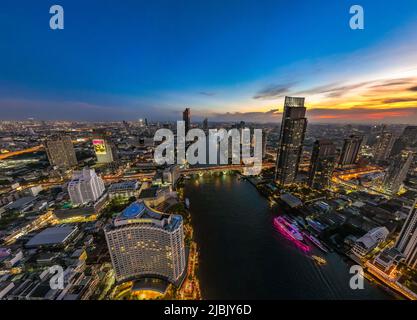 Aerial view of Saphan Taksin district near the Taksin bridge and Chao Phraya river, Bangkok, Thailand Stock Photo