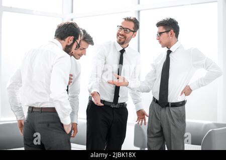 business colleagues discussing the terms of the contract. Stock Photo