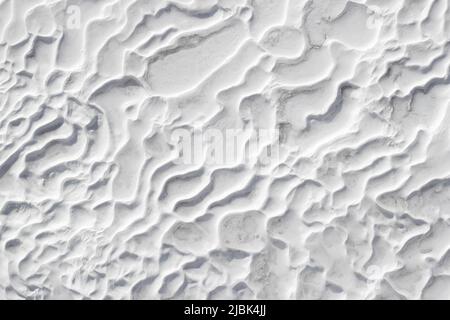 White textured background of Pamukkale calcium travertine in Turkey, abstract pattern of close-up Stock Photo