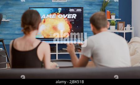 Premium Photo  Boyfriend and girlfriend feeling angry about lost  videogames, playing online on cyberspace. frustrated couple losing gameplay  on television console, gaming in play competition.