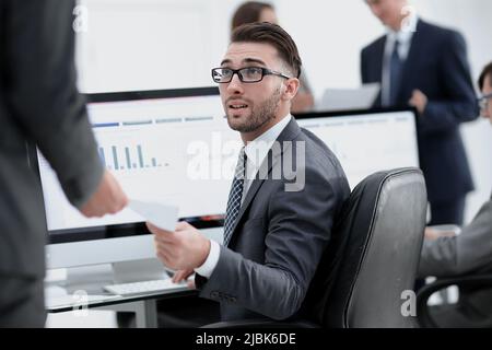 businessman working on a computer on business reports Stock Photo