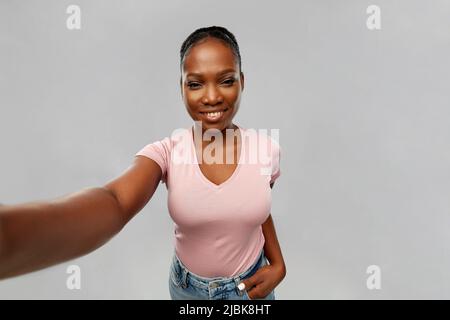 happy african american woman taking selfie Stock Photo