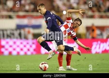 Split, Croatia. 6th June, 2022. Antoine Griezmann (L) of France competes for the ball with Luka Modric of Croatia during their UEFA Nations League League A Group 1 football match at Stadion Poljud in Split, Croatia, on June 6, 2022. Credit: Igor Kralj/PIXSELL via Xinhua/Alamy Live News Stock Photo