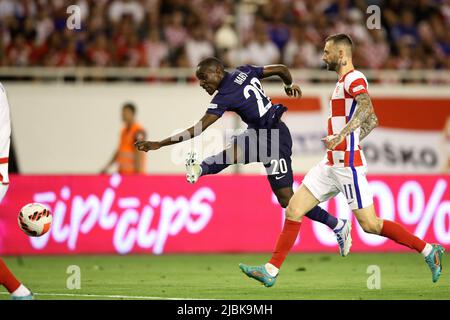 Split, Croatia. 6th June, 2022. Moussa Diaby (L) of France shoots during the UEFA Nations League League A Group 1 football match between Croatia and France at Stadion Poljud in Split, Croatia, on June 6, 2022. Credit: Igor Kralj/PIXSELL via Xinhua/Alamy Live News Stock Photo