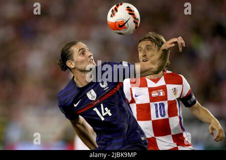 Split, Croatia. 6th June, 2022. Adrien Rabiot (L) of France competes for the ball with Luka Modric of Croatia during their UEFA Nations League League A Group 1 football match at Stadion Poljud in Split, Croatia, on June 6, 2022. Credit: Igor Kralj/PIXSELL via Xinhua/Alamy Live News Stock Photo