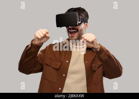 happy smiling young man in vr glasses Stock Photo