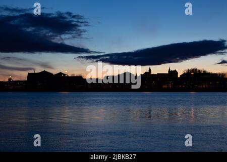 Evening photo of Akershus festning in Oslo, the main capital of Norway. Sunset, with nice clouds and colors in the sky. Stock Photo