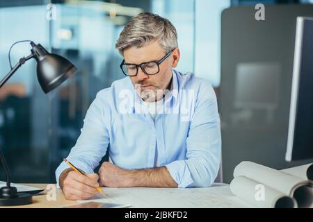 Experienced architect designer head working on projector portrait close up photo Stock Photo