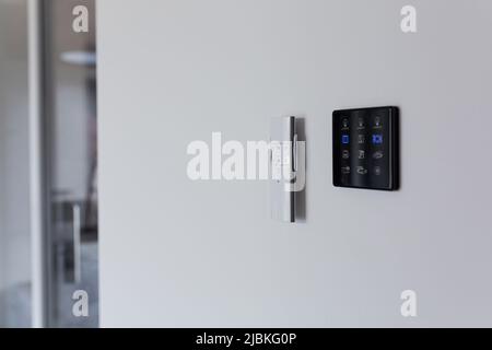 Control panel, air conditioning and heating system of the house, on a white wall, smart home Stock Photo