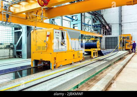 automated line for the production of hollow core slabs; a premises inside the plant with new equipment with remote control for engineer of control flo Stock Photo