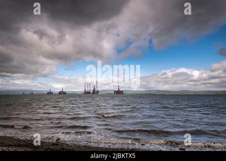 A cloudy, summer HDR image of the Oil rig graveyard in the Cromarty Firth near Invergordon, Scotland. 27 May 2022 Stock Photo