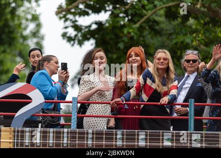 Celebrities on open top bus at the Queen's Platinum Jubilee Pageant parade in The Mall, London, UK. 1990s bus Stock Photo