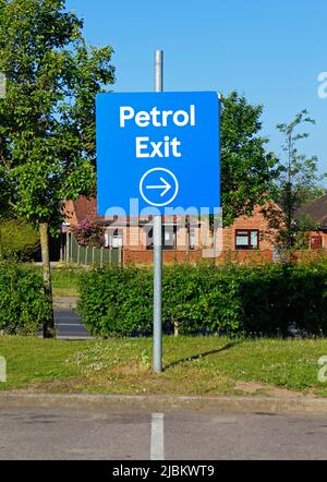 A Tesco Extra supermarket car park sign indicating exit and direction to petrol filling station at Sprowston, Norfolk, England, United Kingdom. Stock Photo