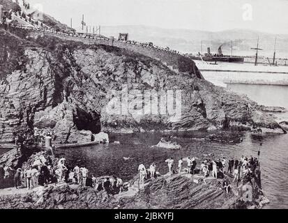 Douglas, Isle of Man. The bathing place at Port Skillion, seen here in the 19th century.  From Around The Coast,  An Album of Pictures from Photographs of the Chief Seaside Places of Interest in Great Britain and Ireland published London, 1895, by George Newnes Limited. Stock Photo