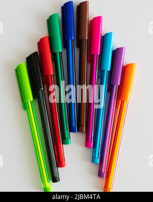 Colorful plastic ballpoint writing pens isolated on a white background. Stock Photo