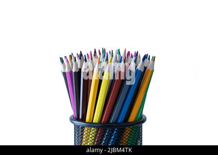 Sharpened color pencils standing in a pencil holder isolated on a white background. Stock Photo