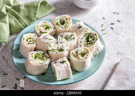 Cream cheese dill cucumber tortilla wrap Stock Photo