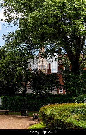 The Historic church of St Mary Magdalene boast the tallest Spire in The county of Nottinghamshire and stands amongst the towns buildings. Stock Photo