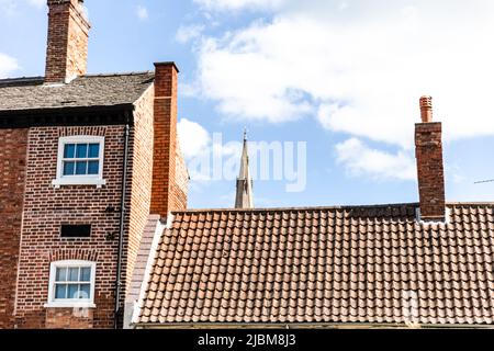 The Historic church of St Mary Magdalene boast the tallest Spire in The county of Nottinghamshire and stands amongst the towns buildings. Stock Photo