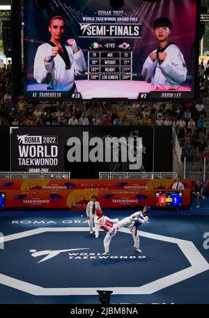 Taekwondo ground and banner with fighter in action . World Taekwondo championship, Rome, Italy, june 4 2022 Stock Photo