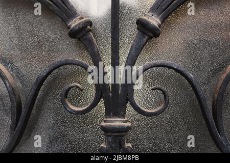 Details of metal decoration, view on ornaments over glass. Stock Photo