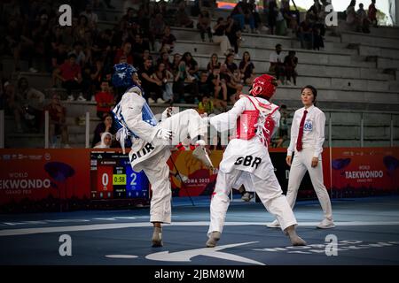 Female taekwondo fighter combat during match. World Taekwondo championship, Rome, Italy, june 4 2022 Stock Photo