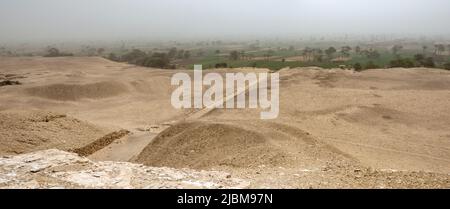 View of the causeway from the Meidum Pyramid Known as the ‘Collapsed Pyramid of  Meidum  near the Fayoum, Nile Valley, Egypt. Stock Photo