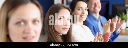 Workers in presentable suits sit in room Stock Photo