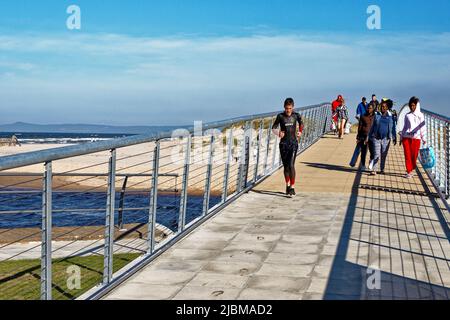 LOSSIEMOUTH MORAY SCOTLAND PEOPLE CROSSING THE NEW BRIDGE OVER THE RIVER LOSSIE Stock Photo