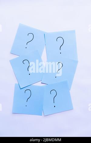top view of blue cards with question marks on white background Stock Photo