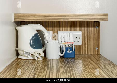 The kettle and tea and coffee making facilities in a budget hotel Stock Photo