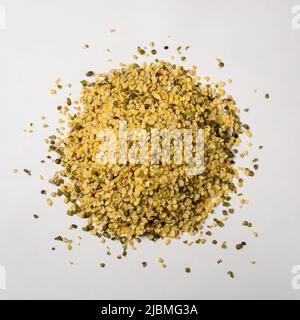 heap of split skin removed mung beans or green grams, also known as moong seeds, staple ingredient in southeast asian dishes, protein rich legumes