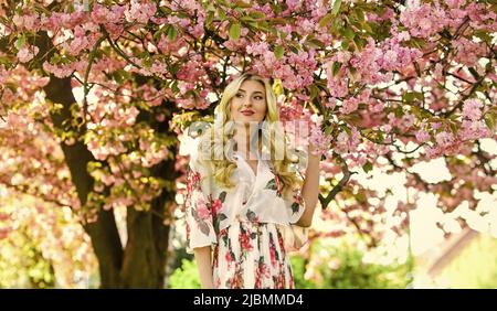 Happy spring day. Floral aroma. Harmony and female energy. Spring blossoming tree. Spring symbol. Reasons why flowers always make women happy. Girl Stock Photo