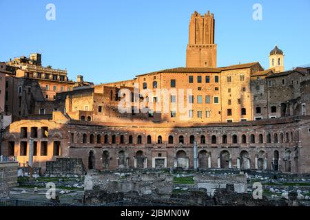 Late afternoon sunlight on Trajan's Market, with the Torre delle Milizie in the background.  Via dei Fori Imperiali, central Rome. Lazio, Italy Stock Photo