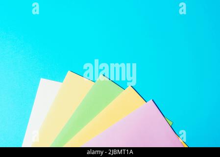 Colorful envelopes on light blue background. Top view, flat lay, copy space. Stock Photo