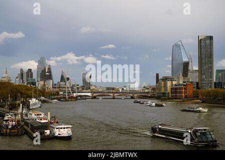 The London Skyline including St. Pauls Cathedral with the Thames and some Boats in the foreground. Stock Photo