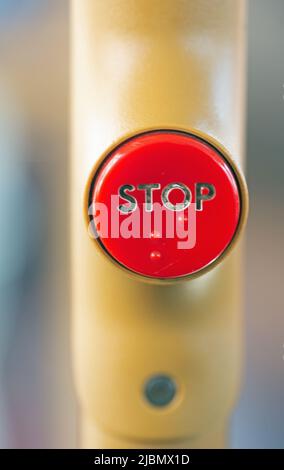 Close up photograph of a stop button on a bus Stock Photo