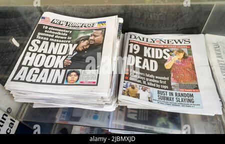 Front pages of New York newspapers on Wednesday, May 25, 2022 report on the previous days’ mass shooting in the Robb Elementary School in Uvalde, TX by 18 year old Salvador Ramos which left 19 children and two teachers dead.  (© Richard B. Levine) Stock Photo