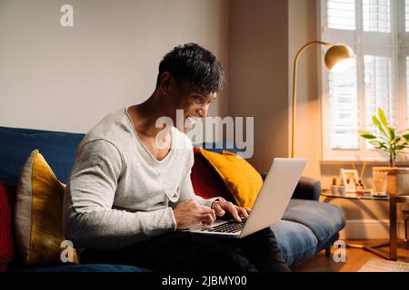 Young Asian man working online Stock Photo