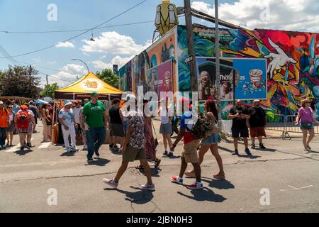 Thousands pour into Bushwick, Brooklyn in New York for the annual Bushwick Collective Block Party on Saturday, June 4, 2022. Music and partying brought some but the real attraction was the new murals  by 'graffiti' artists that decorate the walls of the buildings that the collective uses.  (© Richard B. Levine) Stock Photo